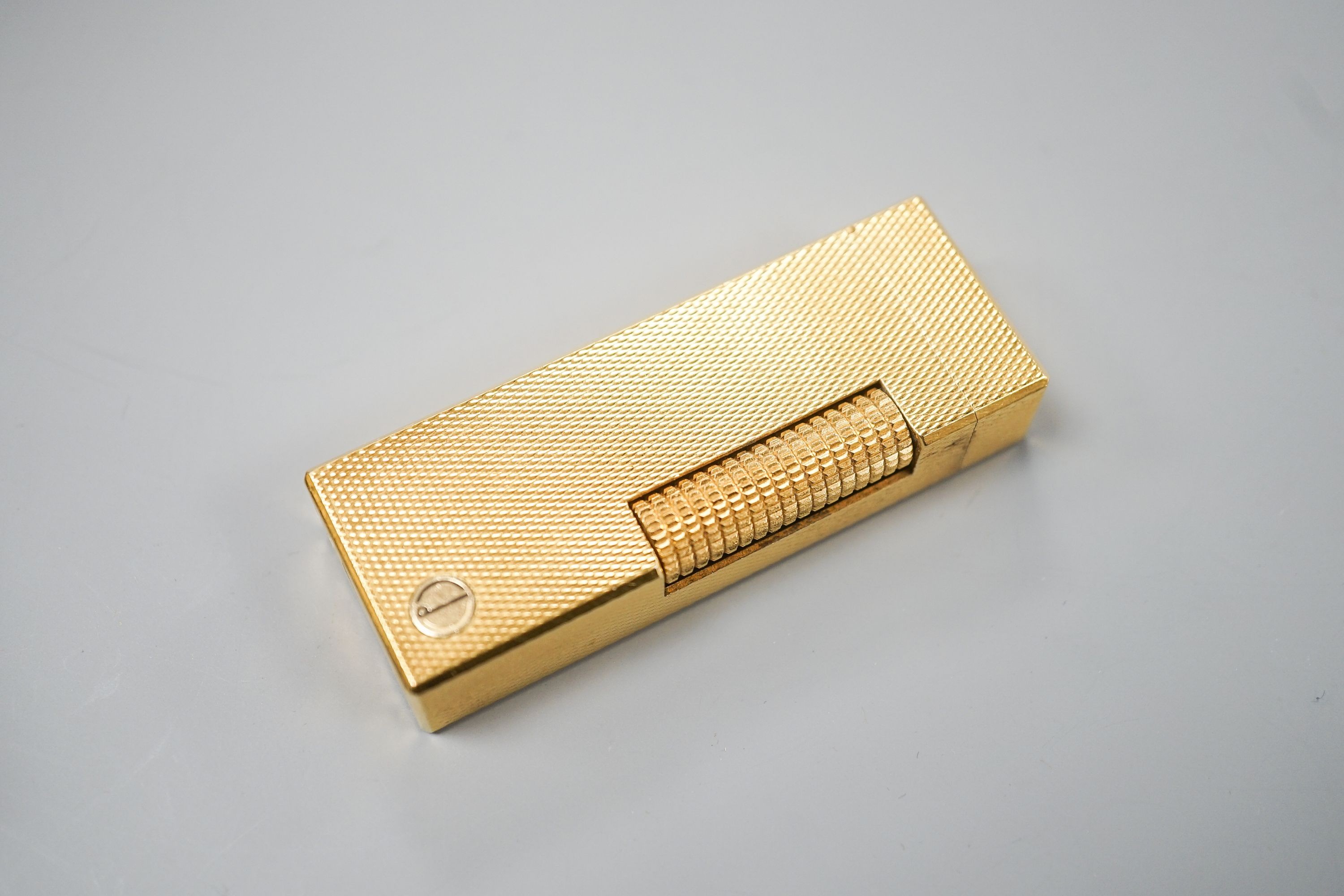 A cased Dunhill gold plated lighter
